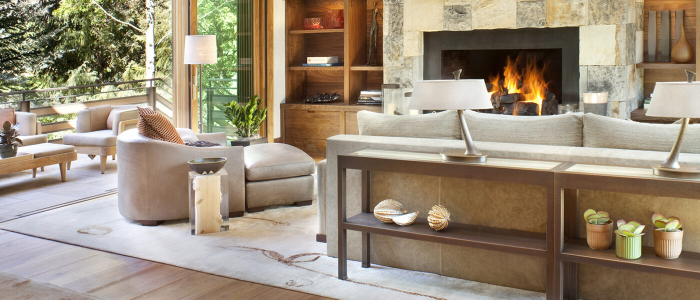 Indoor outdoor living room with stone fireplace
