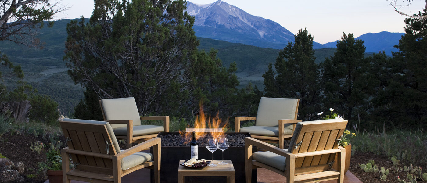 Outdoor seating area with a firepit and mountain views