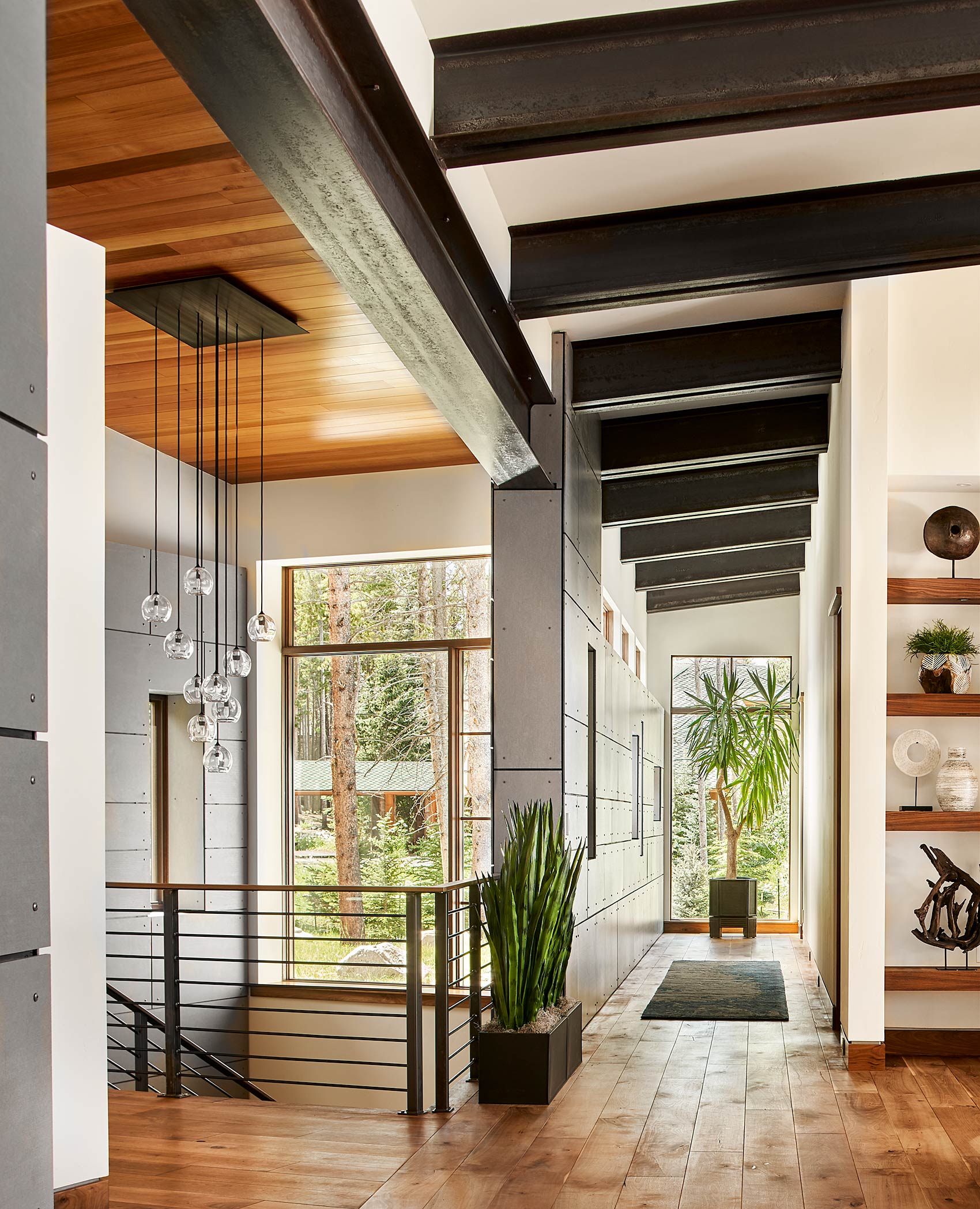 Interior hallway and stairs showcasing mixed use of steel and wood