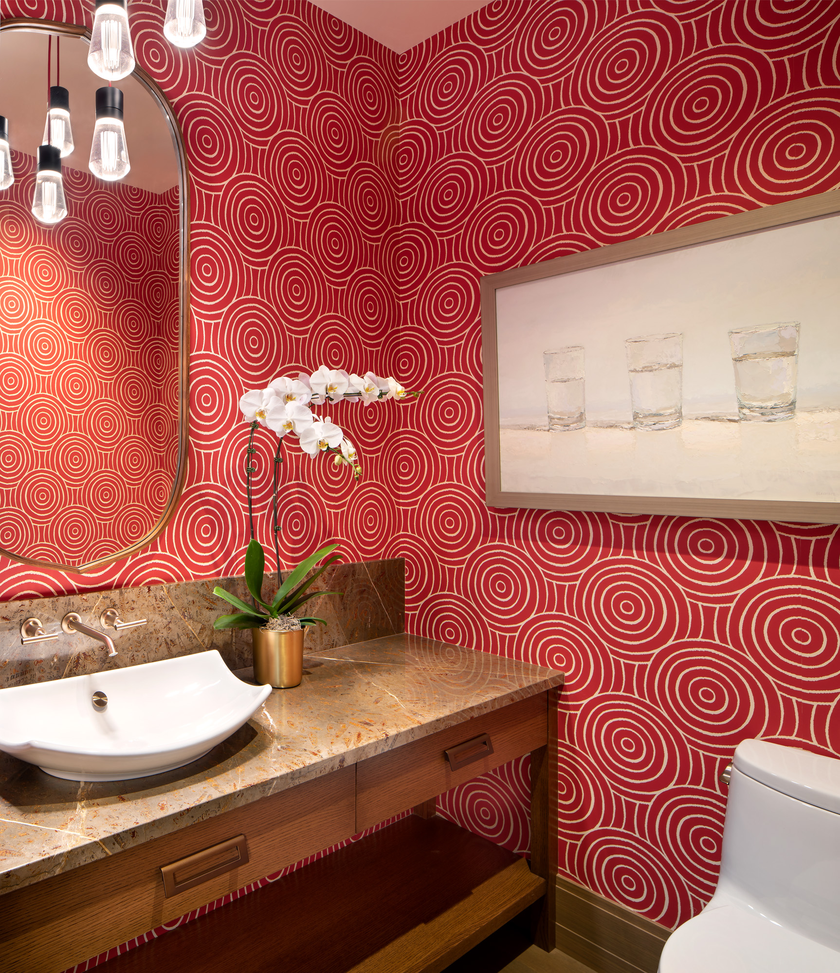 urban color powder room with decorative red swirl wallcovering