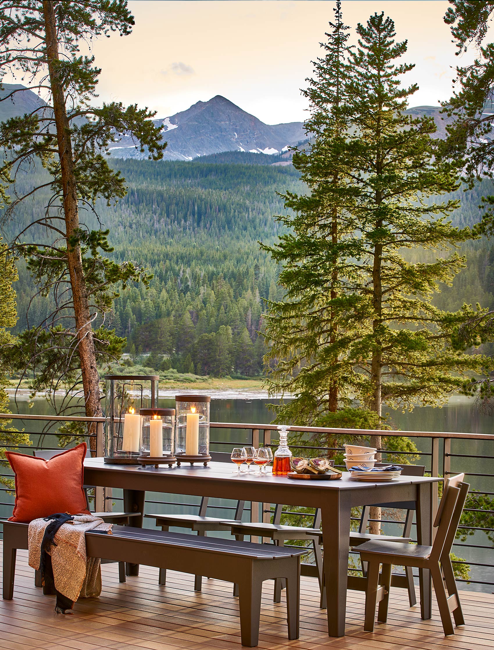 Mountain retreat deck with picnic table and lake view